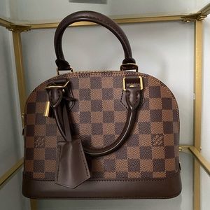 Authentic Louis Vuitton Bag 
Damier Ebene Alma